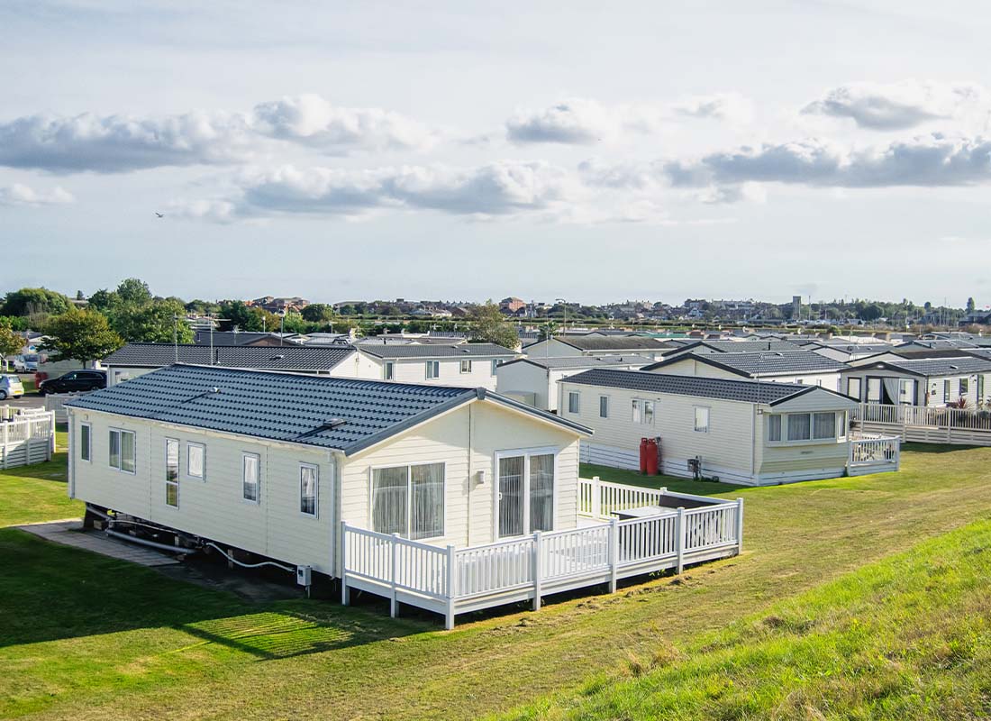 Mobile Home Park Insurance - Landscape View of a Row of Mobile Homes in a Clean and Newly Developed Mobile Home Park on a Sunny Day